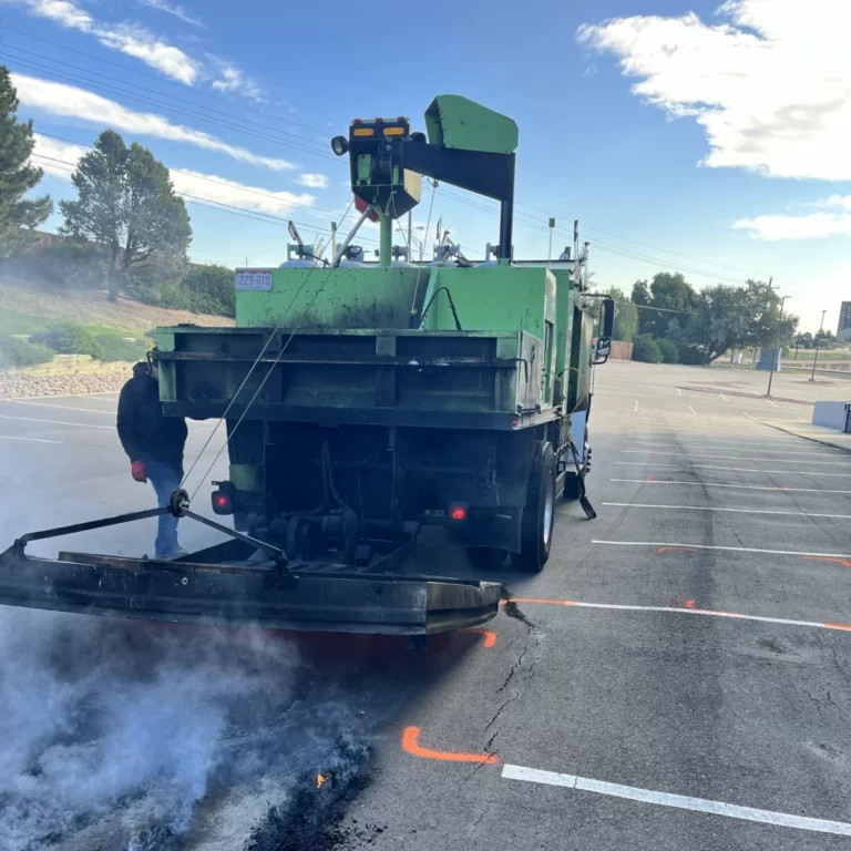 Asphalt Coatings Company crew heating asphalt for a parking lot repair