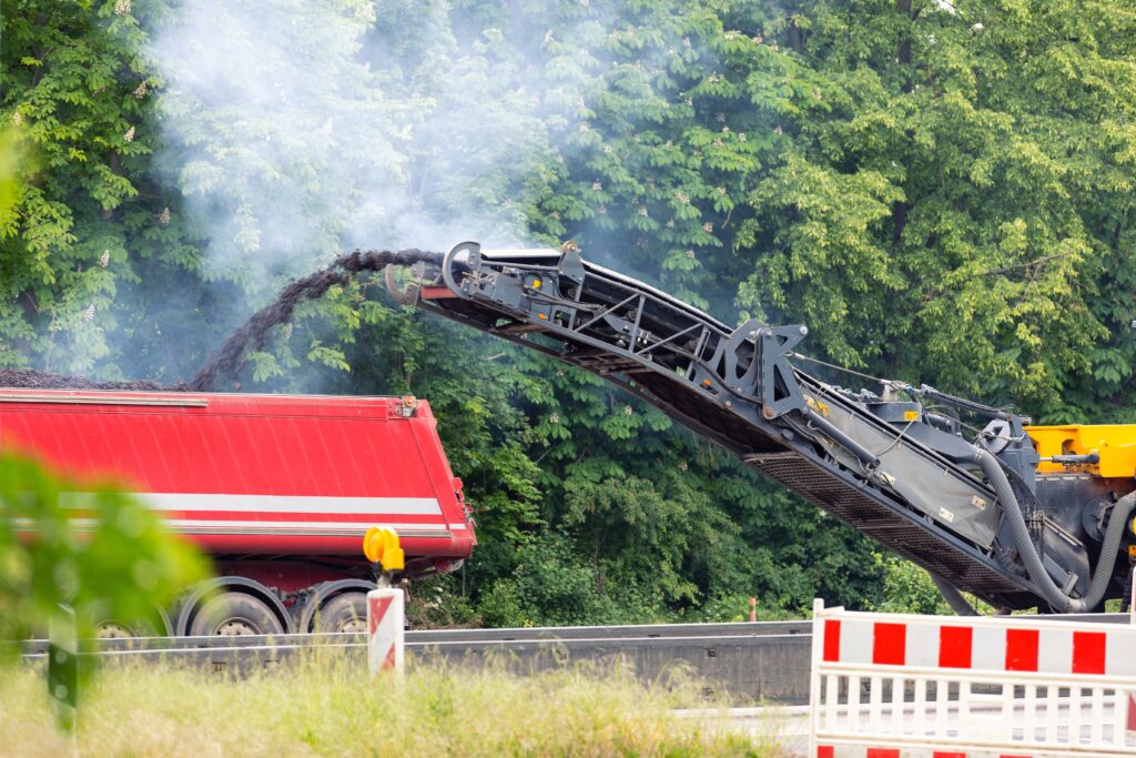Asphalt milling and grinding machine at road repair